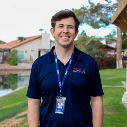 Headshot of Noble Hospice CEO, Jack, standing in front of a lake.