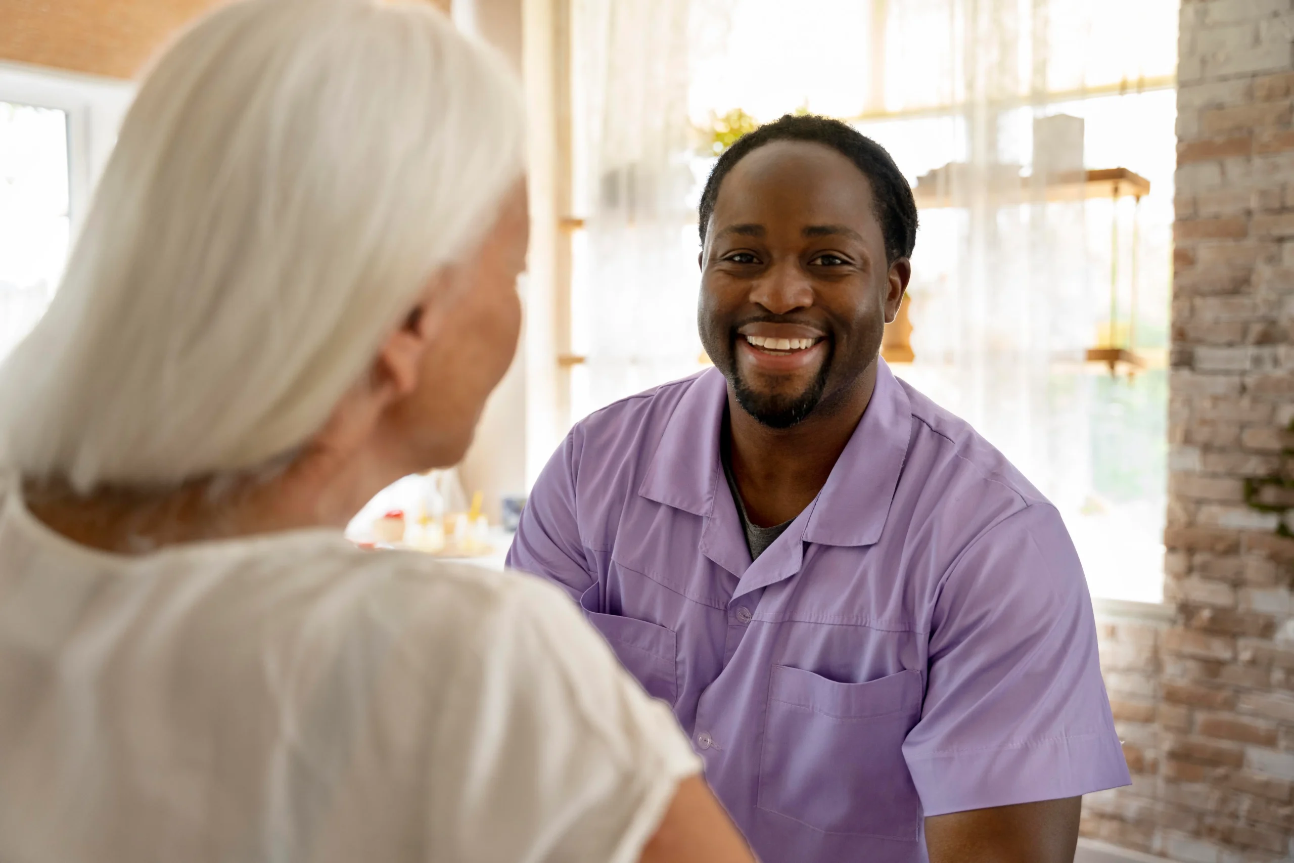 A Noble Hospice volunteer spending quality time with a patient, offering companionship and support.