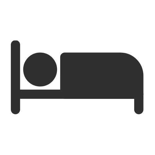 An icon of a person lying in a bed, representing respite care services.